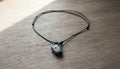Black Cord Necklace with a Bone Pendant